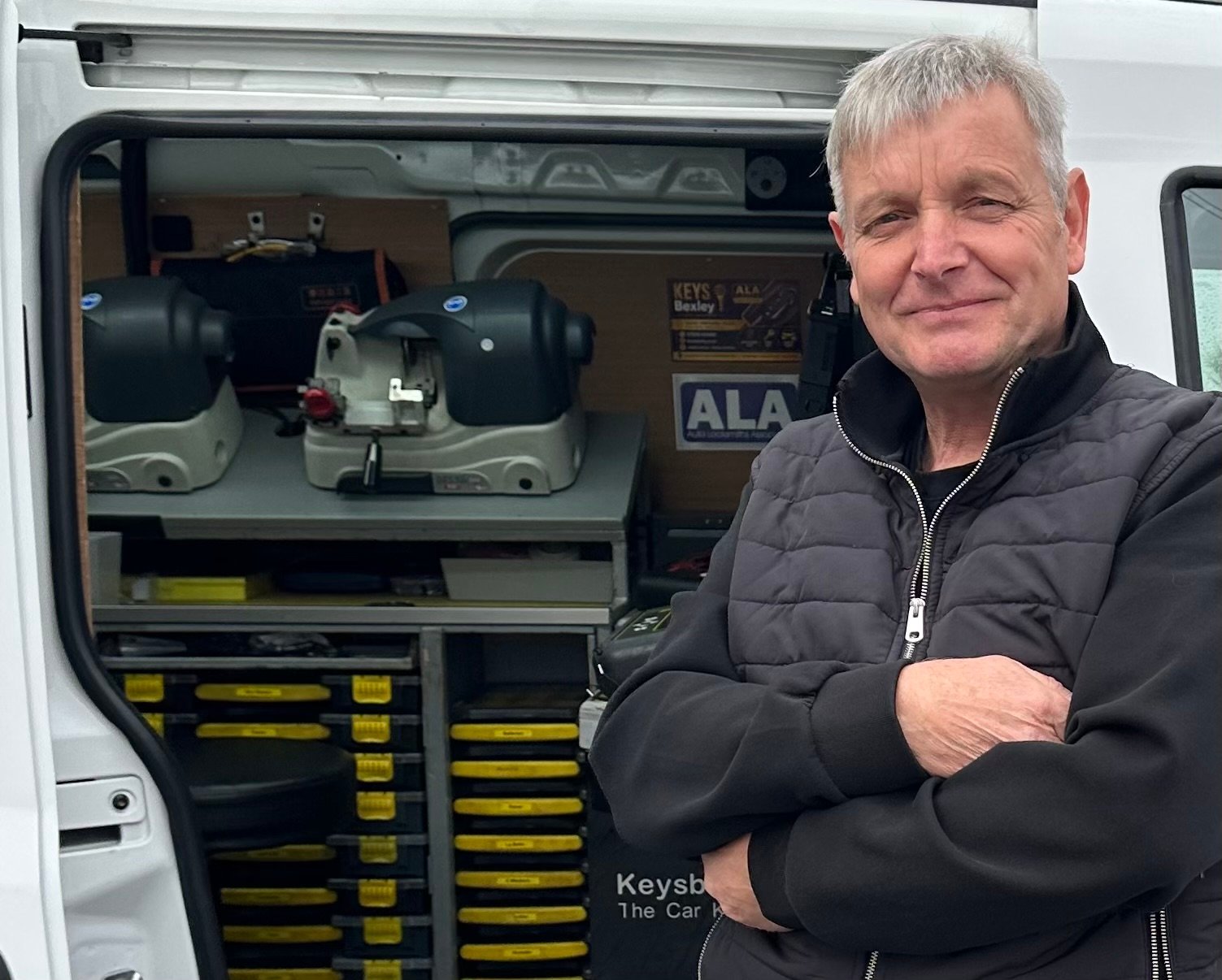 Terry from Keys Bexley beside the mobile auto locksmith van